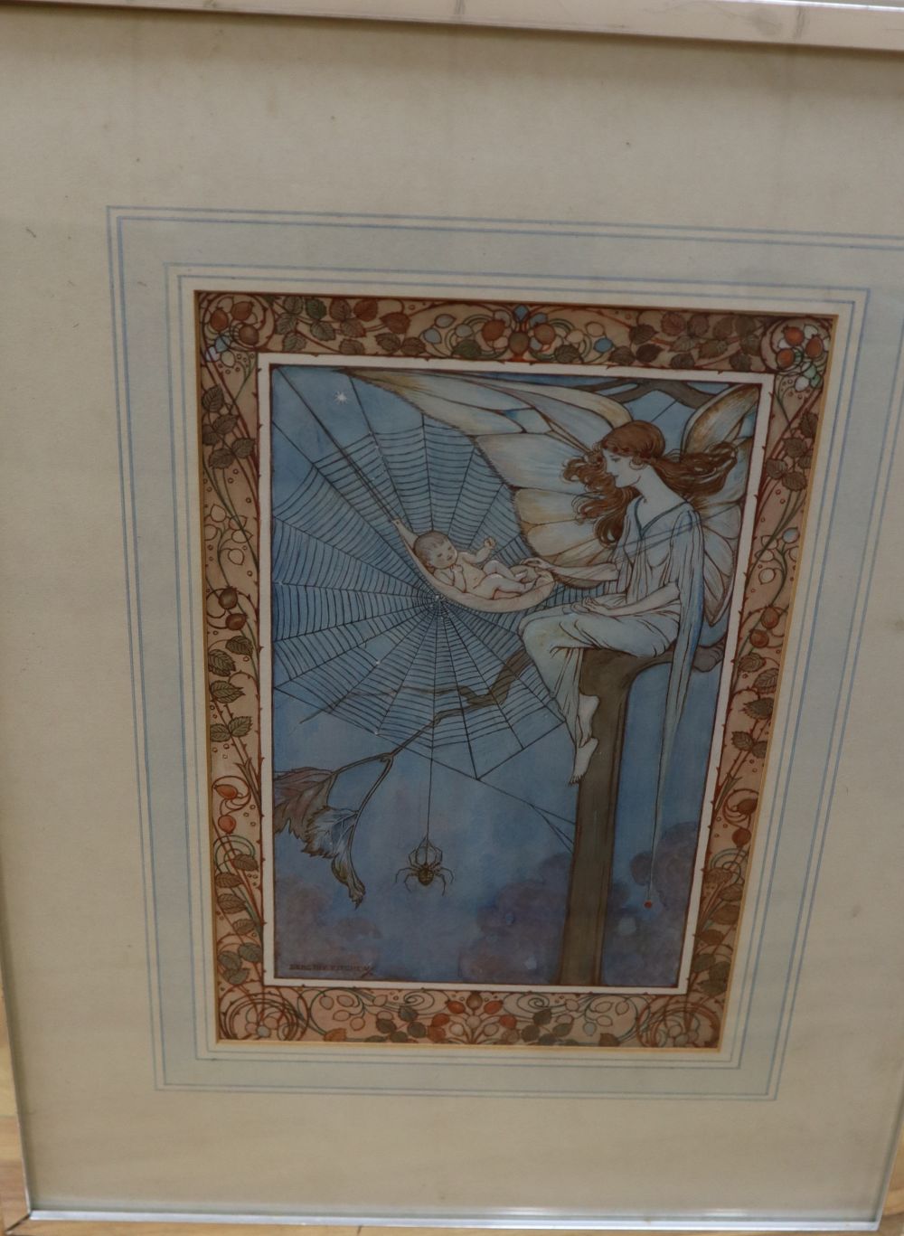 Dorothy Fitchew (19th/20th century), watercolour, fairy with baby cradled in a spiders web, decorative boder, signed, 28 x 18cm